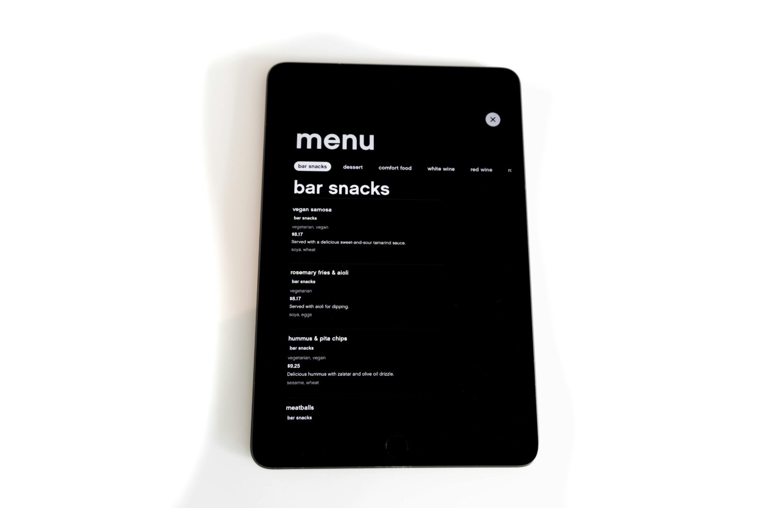 A sleek tablet showcasing the digital menu with enticing bar snack options can elevate any restaurant's website. It's like bringing the vibrant photos of delicious bites to life on a screen, all while maintaining the convenience of traditional PDF menus.